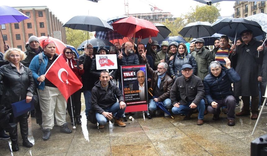 Köln’de Tele1 ve Merdan Yanardağ’a yağmur altında anlamlı dayanışma